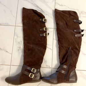 Brown tall boots with gold buckles. Size 10.